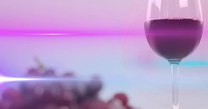 Magenta flare sweeping, camera focusing and shifting view from wine glass to grapes for branding