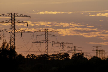 high voltage power lines at sunset