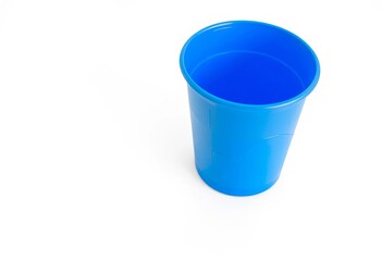 A single, disposable blue paper cup sits on a white background, juice cup, container