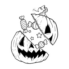 broken pumpkin head filled with treats for Halloween