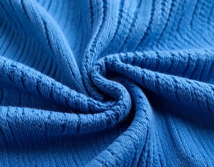 A tightly swirled section of fine, bright blue knitted fabric; a closeup shot highlighting texture