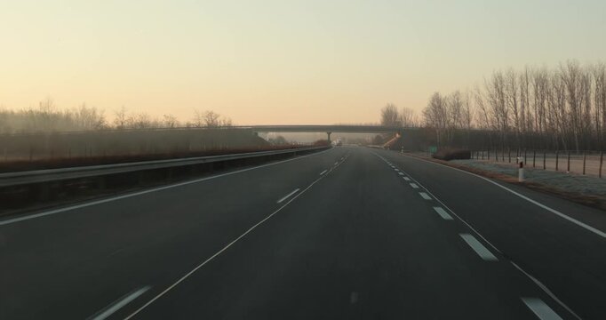 Highway driving view at dawn
