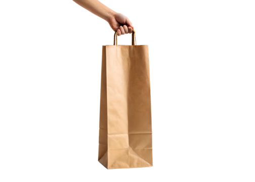 Hand holding a tall narrow brown paper shopping bag with white handles against a solid black background - Powered by Adobe