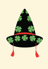 A festive black witch hat adorned with green shamrocks and red tassels for a cheerful celebration.
