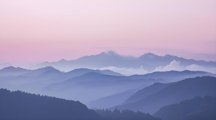 Fototapeta premium A serene mountain landscape blanketed in morning fog at sunrise beneath a clear blue sky