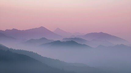 Fototapeta premium Misty mountain landscape at sunrise with fog and forest view
