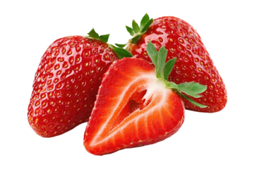 Vibrant ripe strawberries two whole and one halved showing juicy red interior