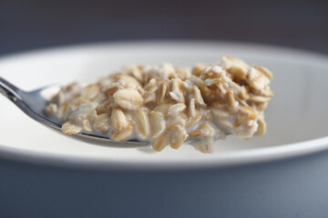 Healthy oats served in a bowl with milk for breakfast