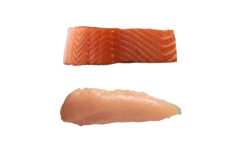 PNG image of A piece of salmon fillet above a chicken breast on a black background in a studio shot