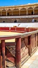 A detailed view inside a traditional amphitheater with wooden fencing