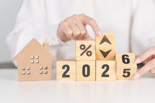 2026 New Year with percentage change to UP and Down arrow with Home model. Real estate Mortgage, Refinance, House loan and debt, Interest rate, Insurance, Financial and Property Tax