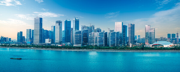 Panoramic view of the modern city financial district skyline with commercial buildings by the river...