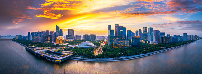 Panoramic view of the central business district skyline with amazing colorful clouds at sunset in Hangzhou.