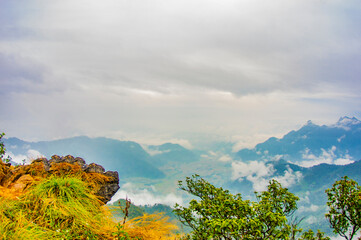 mountain landscape with clouds and sun