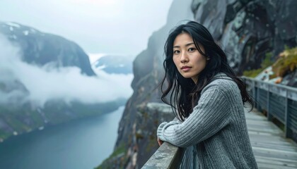 Fictional adult leaning on a cliff boardwalk above a misty fjord moody mid key tones low cloud bands wrapping granite walls and a calm contemplative gaze