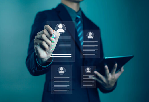 Businessman using digital interface to select candidate profile for recruitment, showing human resource management, data analysis, and modern HR technology concept for business and corporate hiring.