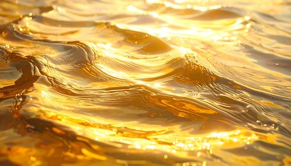 Glowing golden water surface reflecting sunlight, rippling waves