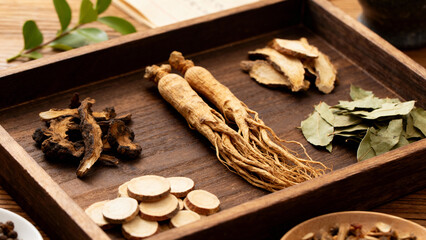 traditional Chinese herbal medicine displayed on wooden tray with dried plants, roots and leaves, natural healing, holistic health, wellness concept, apothecary style.Generated by AI