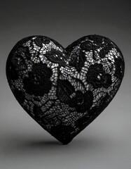 Heart-shaped pillow, detailed black lace design on a gray background