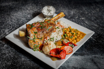 Roasted Lamb Shank with Rice, Chickpeas, and Grilled Vegetables
