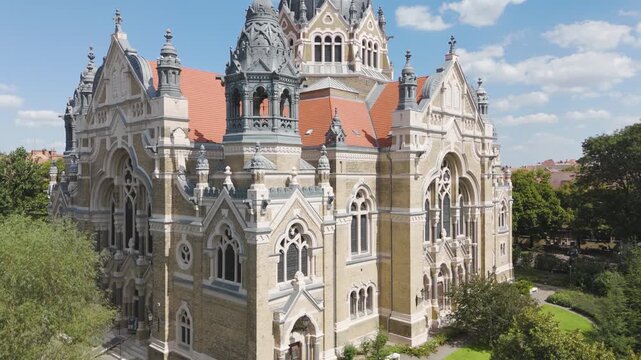 Close-up aerial view of Szeged Synagogue, highlighting its large dome and intricate architectural details.