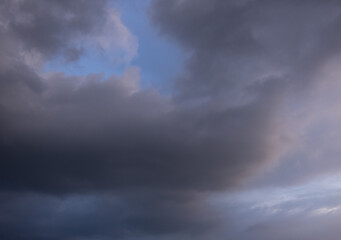 Obraz premium Dark sky with stormy clouds. Dramatic sky rain,Dark clouds before a thunder-storm,clouds before rain