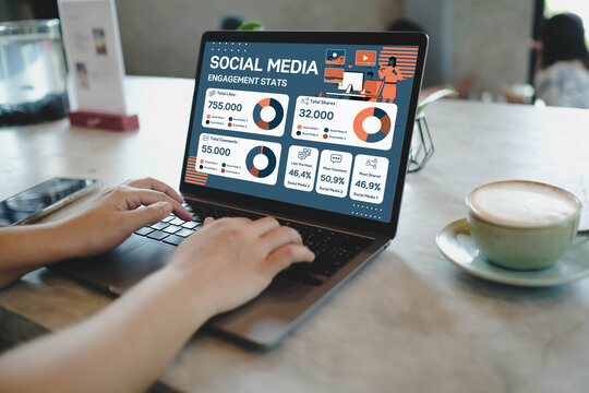 A social media manager analyzing engagement statistics on a dashboard on a laptop, tracking likes, comments, and shares to measure campaign performance.