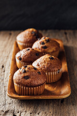 Freshly Baked Chocolate Chip Muffins on Wooden Tray Display