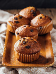 Delicious Chocolate Chip Muffins on Wooden Tray