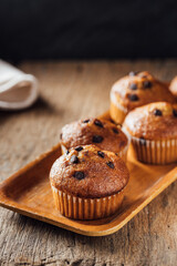 Freshly Baked Chocolate Chip Muffins on Wooden Tray Display