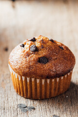 Delicious Chocolate Chip Muffin on Rustic Wooden Background