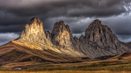Rugged mountain peaks under dramatic lighting with stormy clouds, sharp ridges illuminated by golden sunlight,