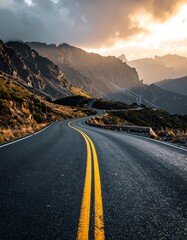 Winding mountain road curves towards a sunlit vista with dramatic clouds