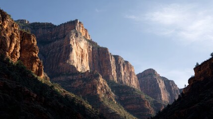 Obraz premium A canyon landscape where the rock formations are carved into the shape of giant, sleeping faces.