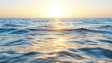 Fototapeta premium Calm sea with gentle waves reflecting sunset colors, creating serene atmosphere