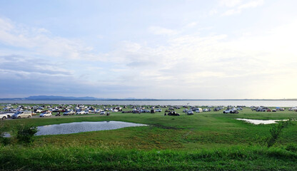 The scenery and atmosphere of the tourist attractions of the Pasak Dam, Thailand, where there are many vehicles traveling to relax and enjoy nature.