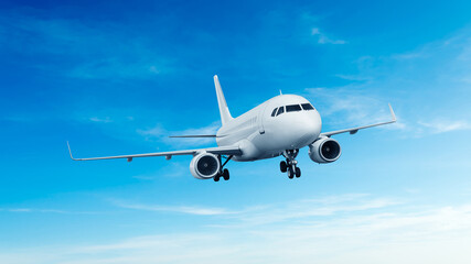 Fototapeta premium White airplane front view flying in the blue sky background. Modern passenger jet airplane.