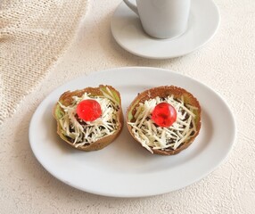 Martabak Terang Bulan mini, or mini sweet martabak (mattabak), is Indonesian popular street food, made from flour, egg, yeast, topped with cheese or chocolate