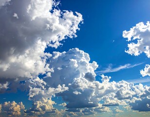 Vivid daytime scene fluffy, white clouds against a vibrant blue sky