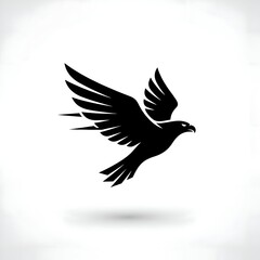 Obraz premium Minimalist Black Eagle or Hawk Silhouette in Flight Against a Pristine White Background
