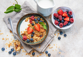Healthy breakfast granola yogurt bowl with fresh berries © Olena Rudo
