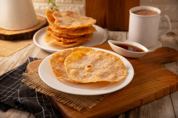 Mexican Buñuelos. Traditional food at Christmas and winter holidays in Mexico, these are fried flour tortillas sprinkled with sugar or covered in a syrup made with piloncillo, cinnamon, and guava.