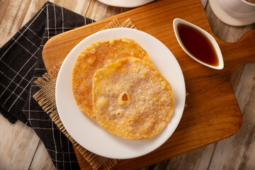 Mexican Buñuelos. Traditional food at Christmas and winter holidays in Mexico, these are fried flour tortillas sprinkled with sugar or covered in a syrup made with piloncillo, cinnamon, and guava.
