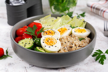 Healthy breakfast Bowl of oatmeal and fresh vegetables.