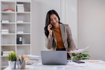 Office, business asian woman and laptop with phone call for communication, financial help or bank...
