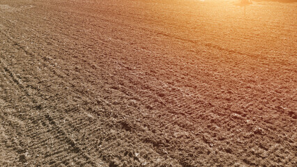 Plowed rural field awaiting the next round of sowing and cultivation
