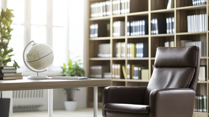 Modern study with comfortable leather chair, globe, and wooden shelves filled with books creates serene atmosphere