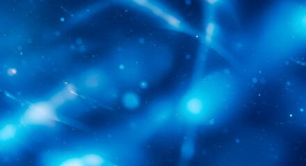 Abstract blue glowing background featuring blurred light streaks and particles, evoking energy