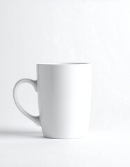 Obraz premium A white ceramic mug with a curved handle, set against a clean, bright white backdrop