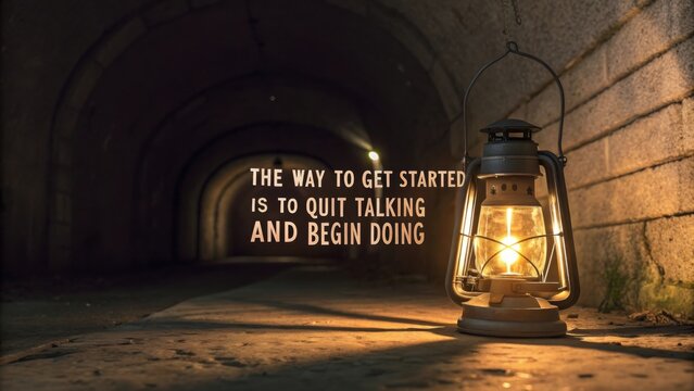 A lit lantern illuminating the dark tunnel with motivational quote
